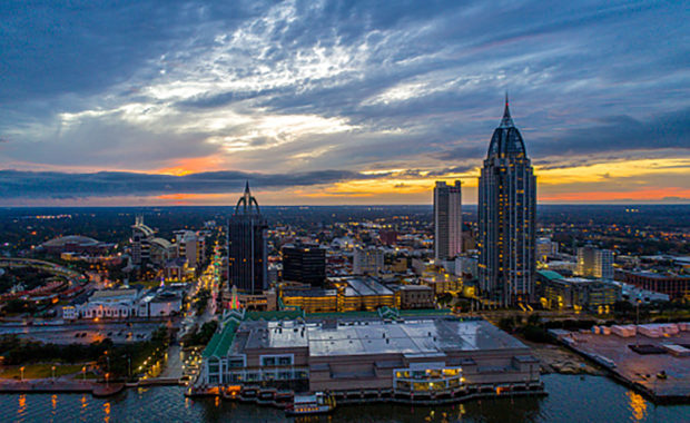 The downtown Mobile, Alabama riverside skyline at sunset